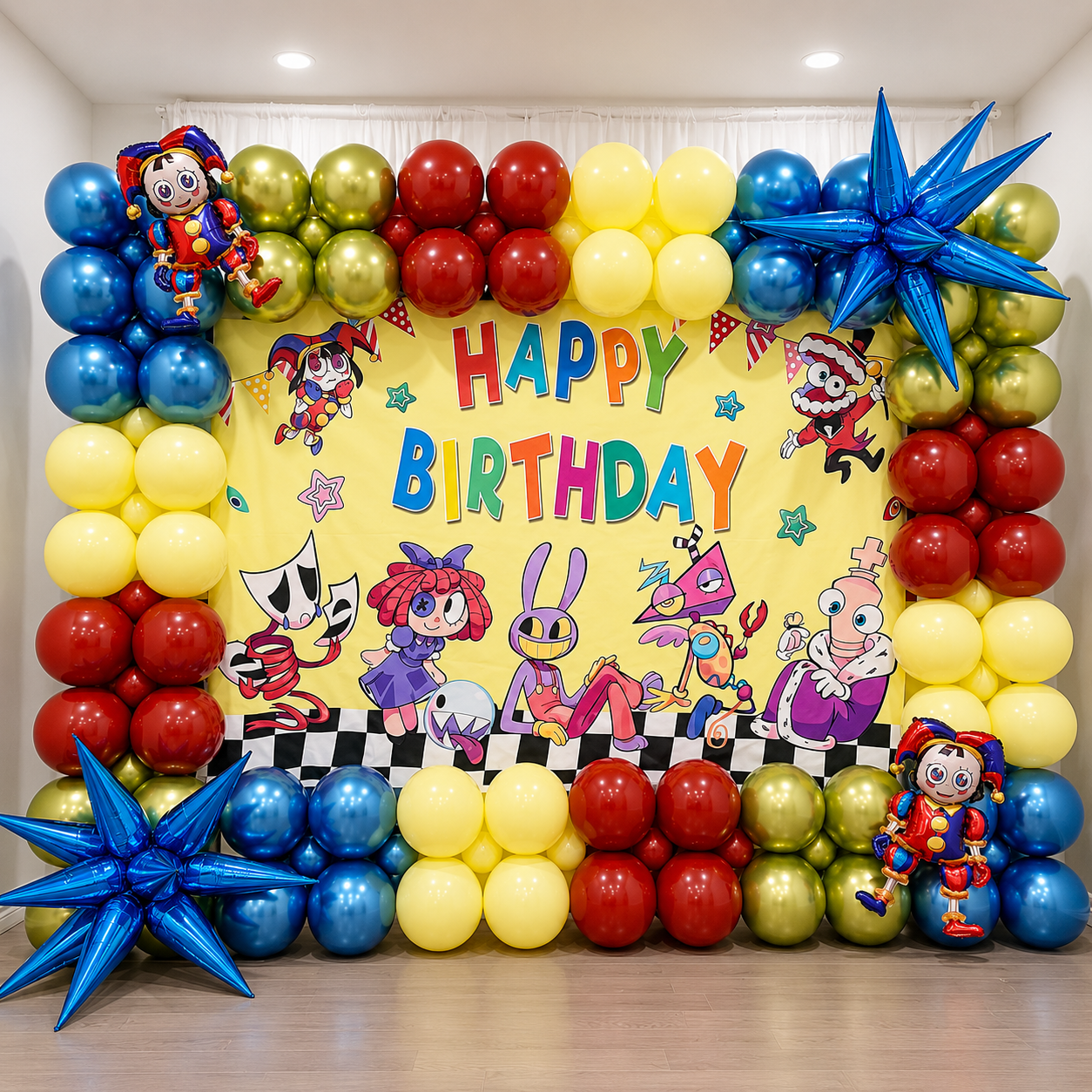Amazing Digital Circus themed birthday backdrop featuring colorful character graphics, red, yellow, blue, and green balloon clusters, metallic blue star balloons, and a large Happy Birthday sign.