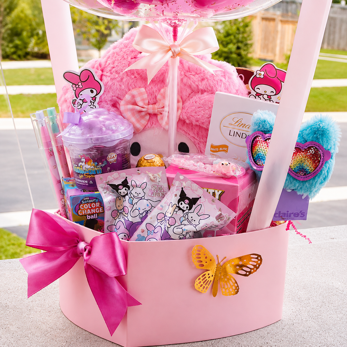 Close-up of a pink My Melody themed birthday gift box featuring a plush toy, candy and beauty items, heart-shaped accessories, butterfly accent, and bright pink satin bow.